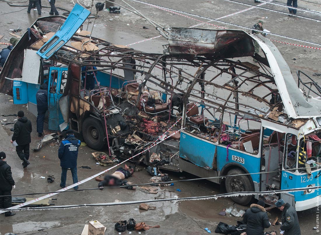 Investigators work at the site of a blast on a trolleybus in Volgograd