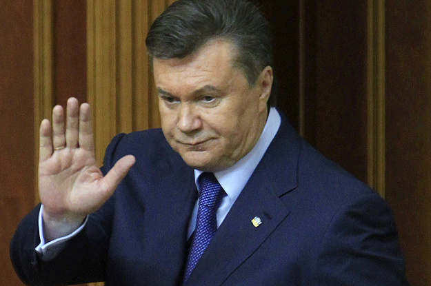 Ukraine's President Viktor Yanukovich acknowledges deputies after delivering his annual address in the chamber of the Ukrainian parliament in Kiev
