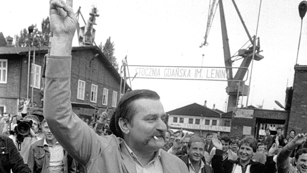 ** FILE ** Lech Walesa, leader of the former Solidarity Union, reacts to cheers by his fellow workers as he leaves the Lenin Shipyards in Gdansk, Poland in this June 17, 1983 file photo. The Solidarity movement 25 years ago when Walesa led a shipyard strike that would last 18 days, planted the seeds for the death of the communist regime nine years later, and foreshadow the collapse of the Soviet Union. The date on which the 1980 accord was signed was Aug. 31, 1980, and this year on Aug. 29-31, international figures will attend 25th anniversary ceremonies in Gdansk and Warsaw. (AP Photo/Langevin/File)