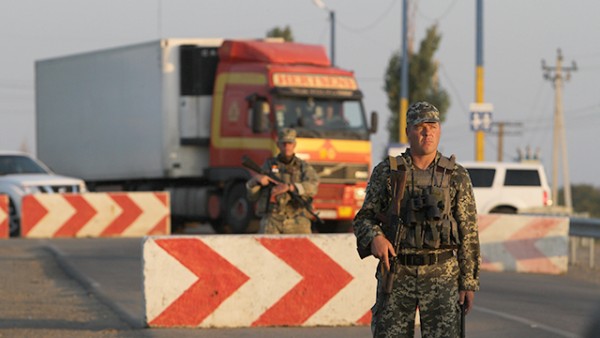 Sept. 20, 2015 - Ukraine - National guard soldiers handle the traffic on the Kalanchak BCP. Chairman of the Mejlis of the Crimean Tatar people Refat Chubarov initiated the transport blockade of the administrative border of the Kherson region and the Crimea from noon September 20 with the aim to cut off supplies of food and other products from the mainland to the annexed territory. Strategic goal: the returning of the Crimea under the control of the Ukrainian authorities. Mr. Chubarov does not rule out that after the ''food blockade'' of the annexed Crimea, the Crimean Tatars will seek an end to the supply of electricity to the peninsula. (Credit Image: В© Sergii Kharchenko/NurPhoto via ZUMA Press)